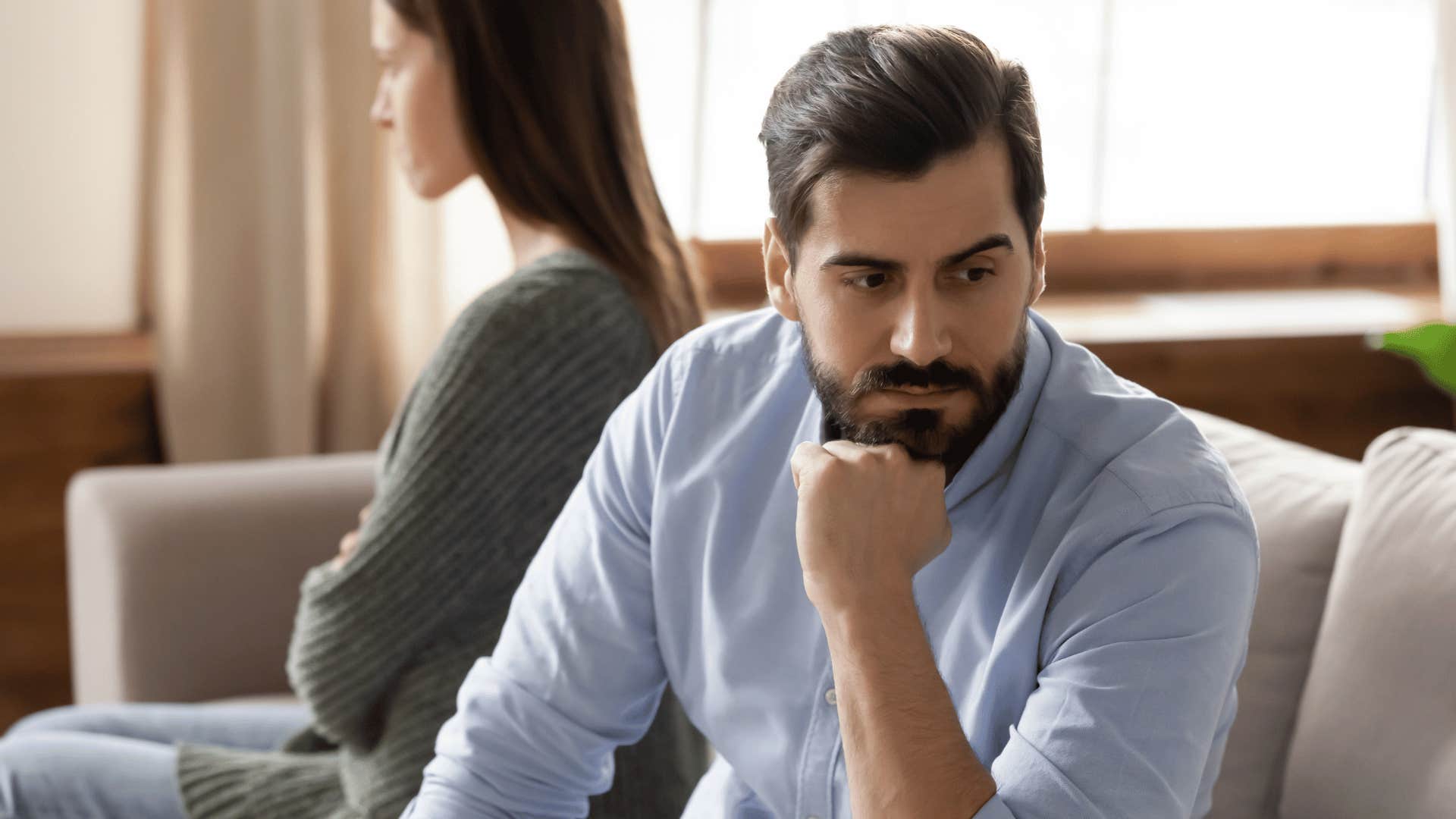 man looking away from woman 