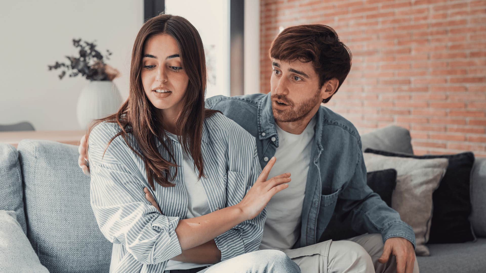 couple arguing on couch