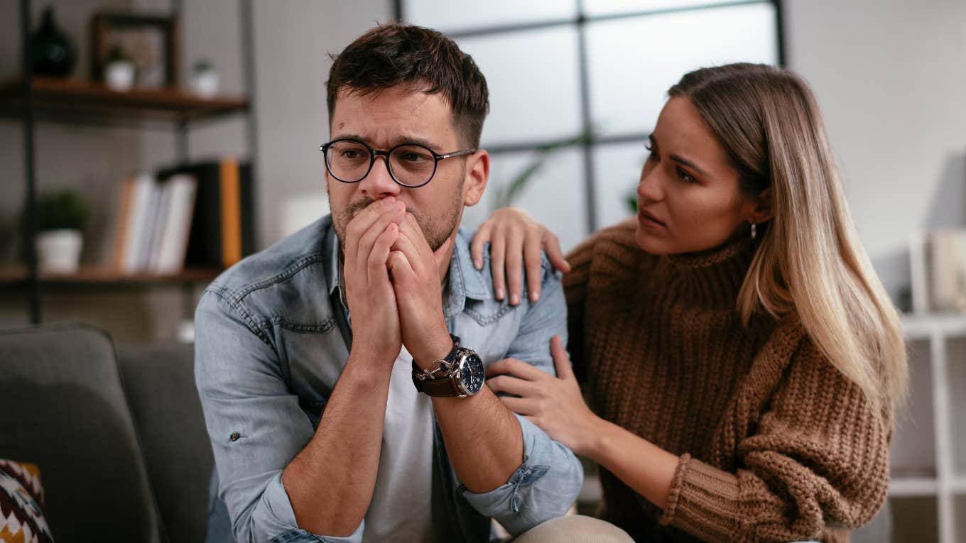 concerned woman comforting man