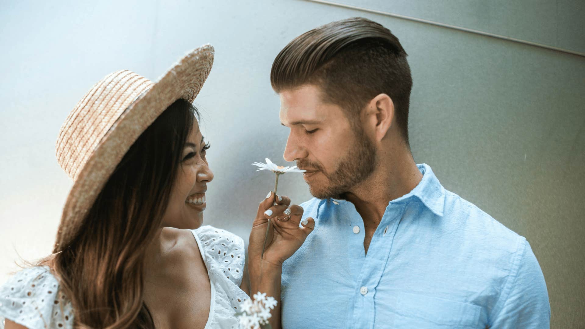 loving couple smelling a flower