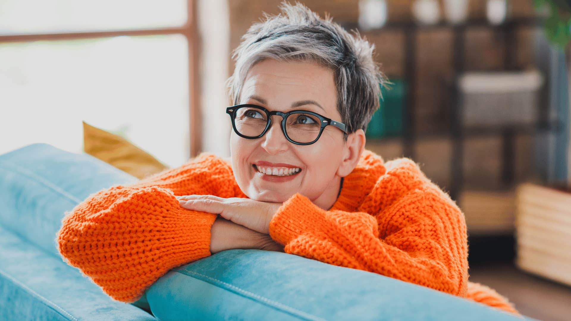 woman daydreaming on couch