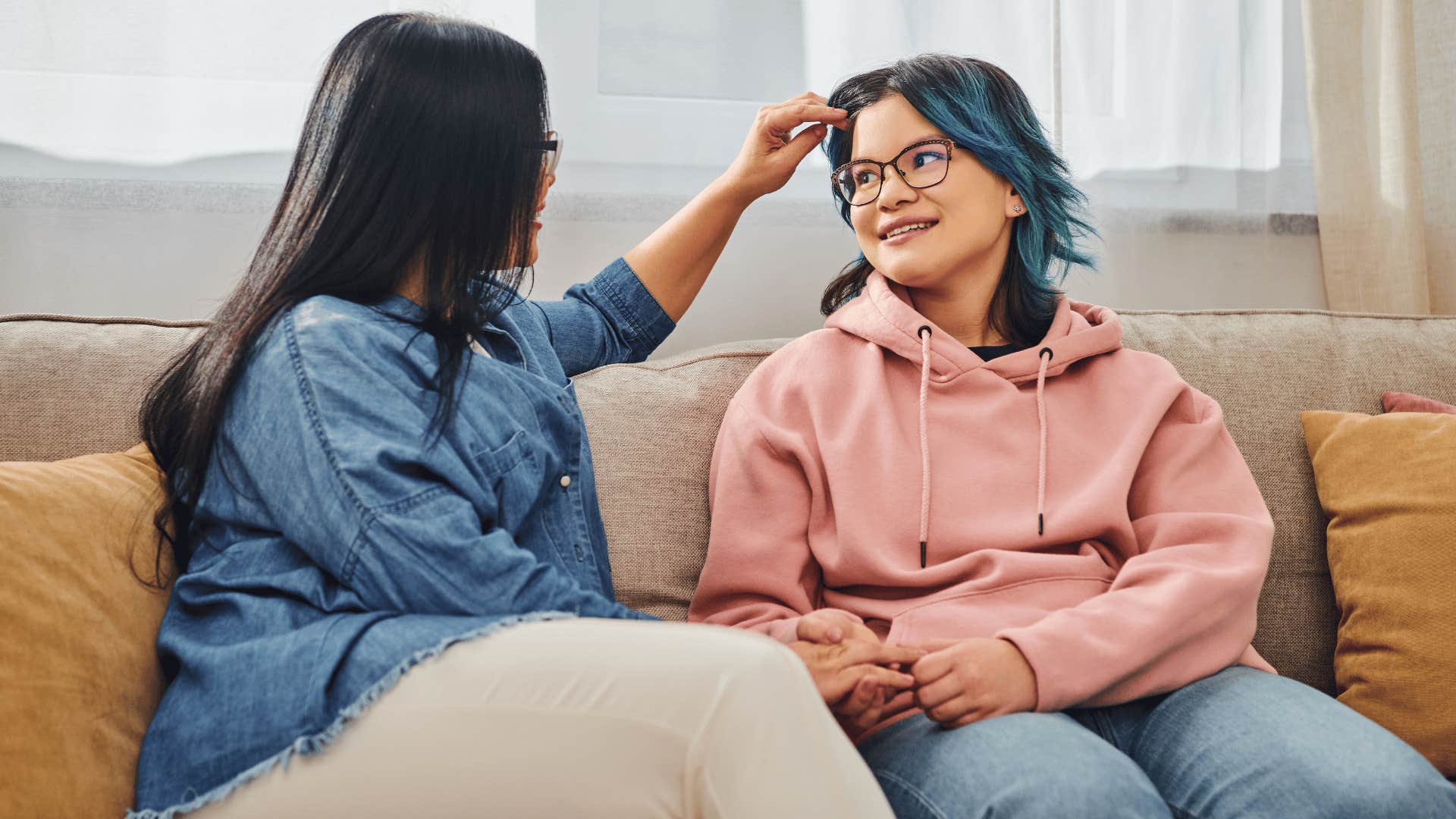 mom being affectionate to daughter