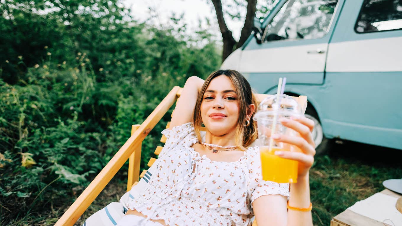 Deeply happy woman enjoying nature and slow lifestyle.