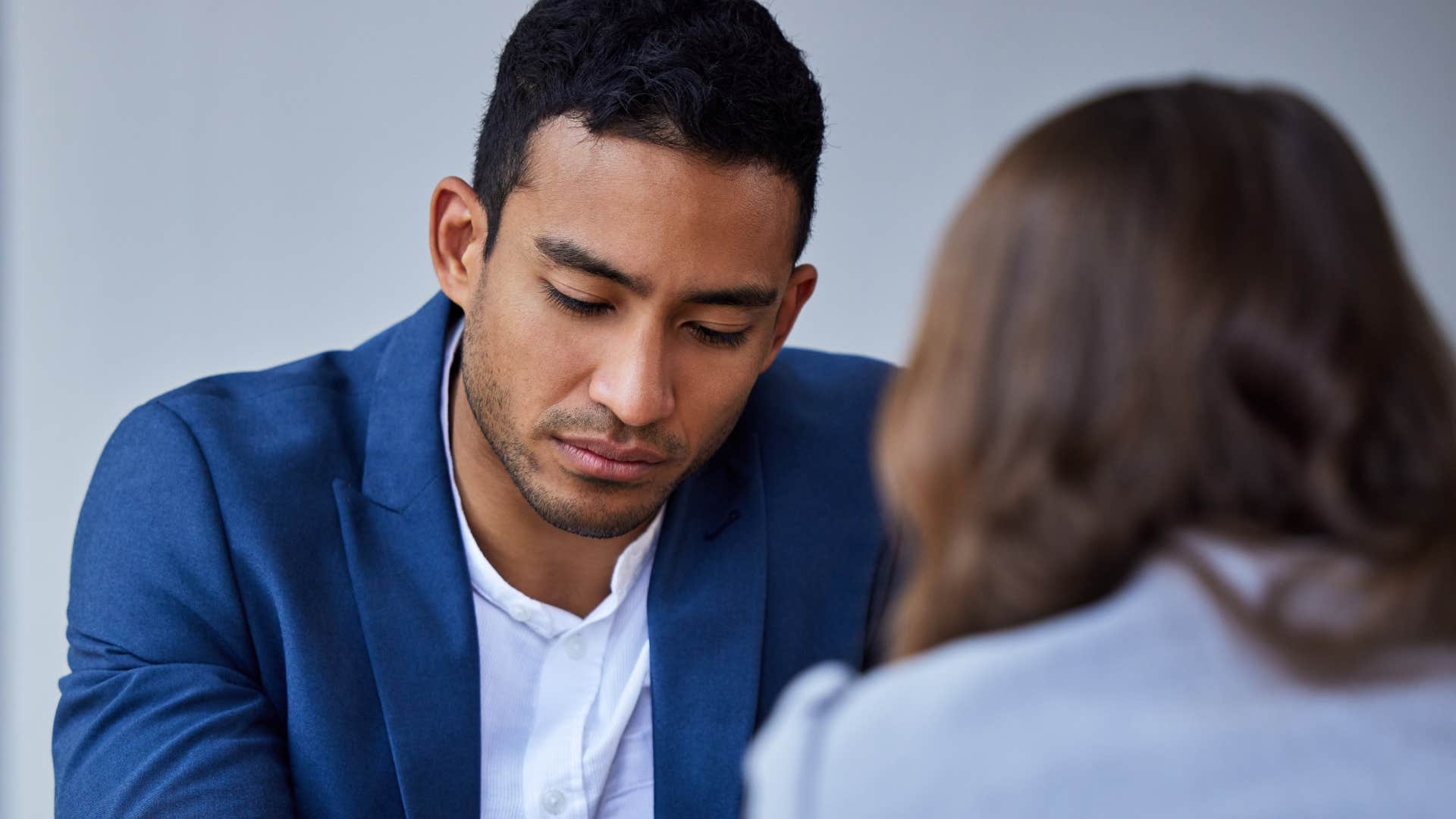 Shot of a unrecognizable woman talking to disappointed man