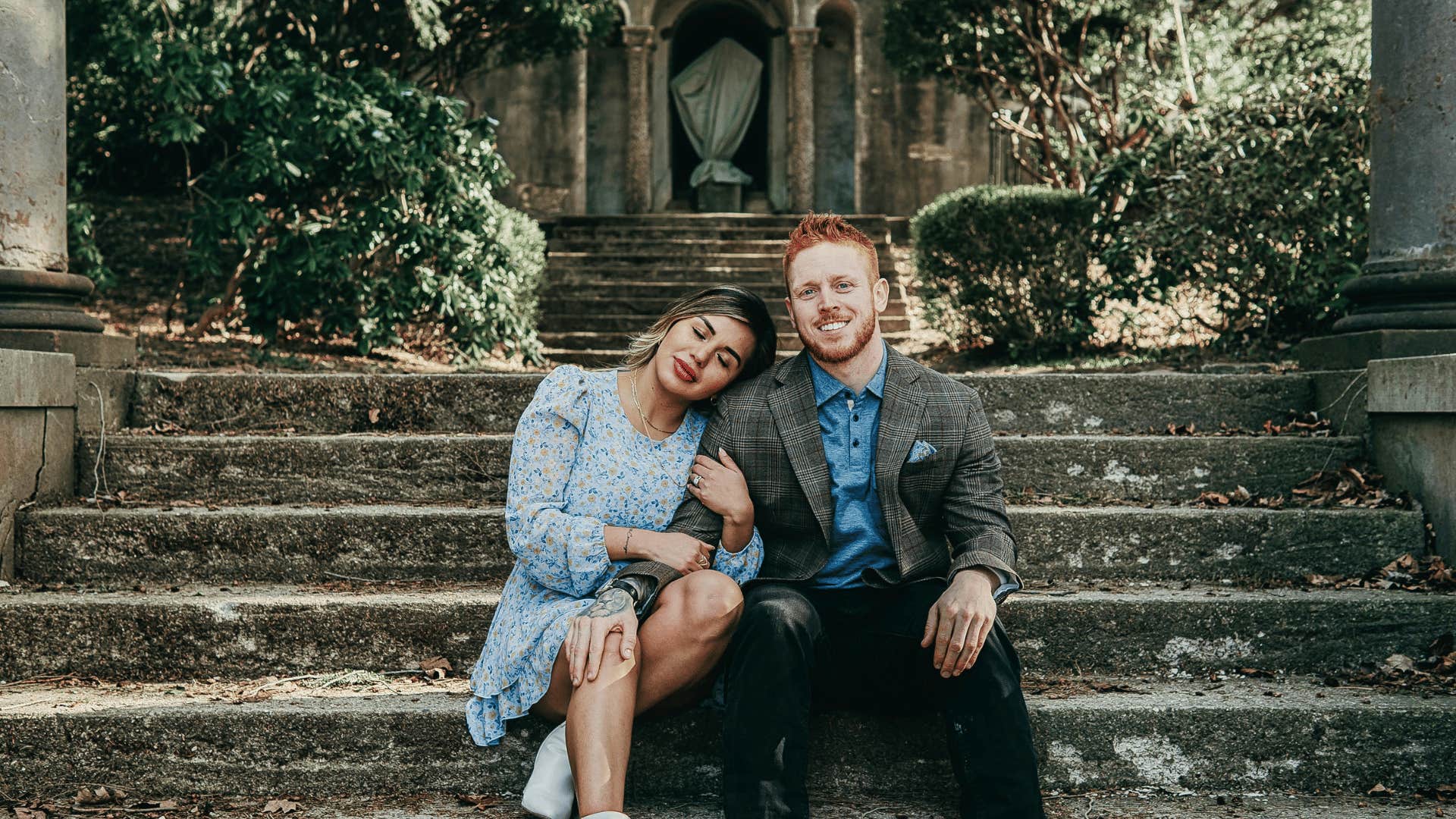 smiling couple on steps