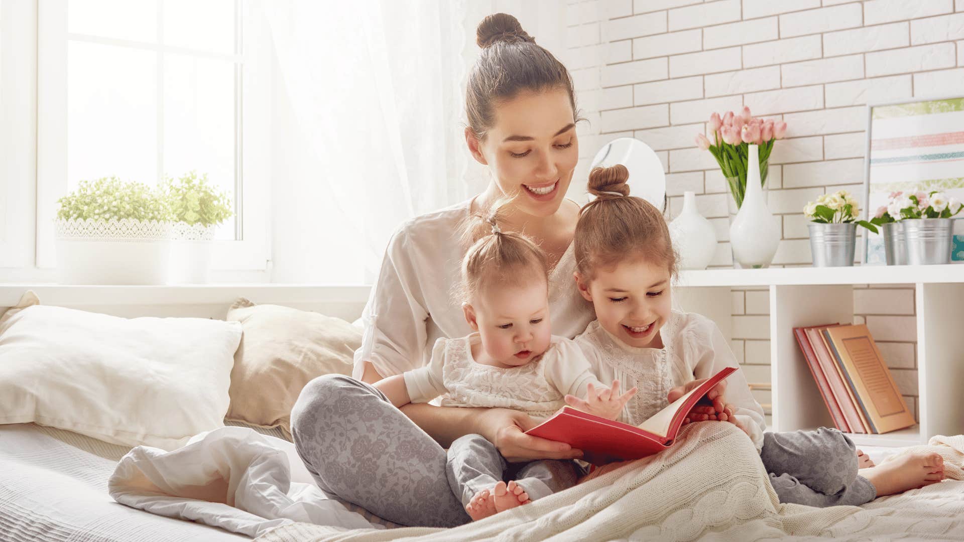 mom reading to her two kids 