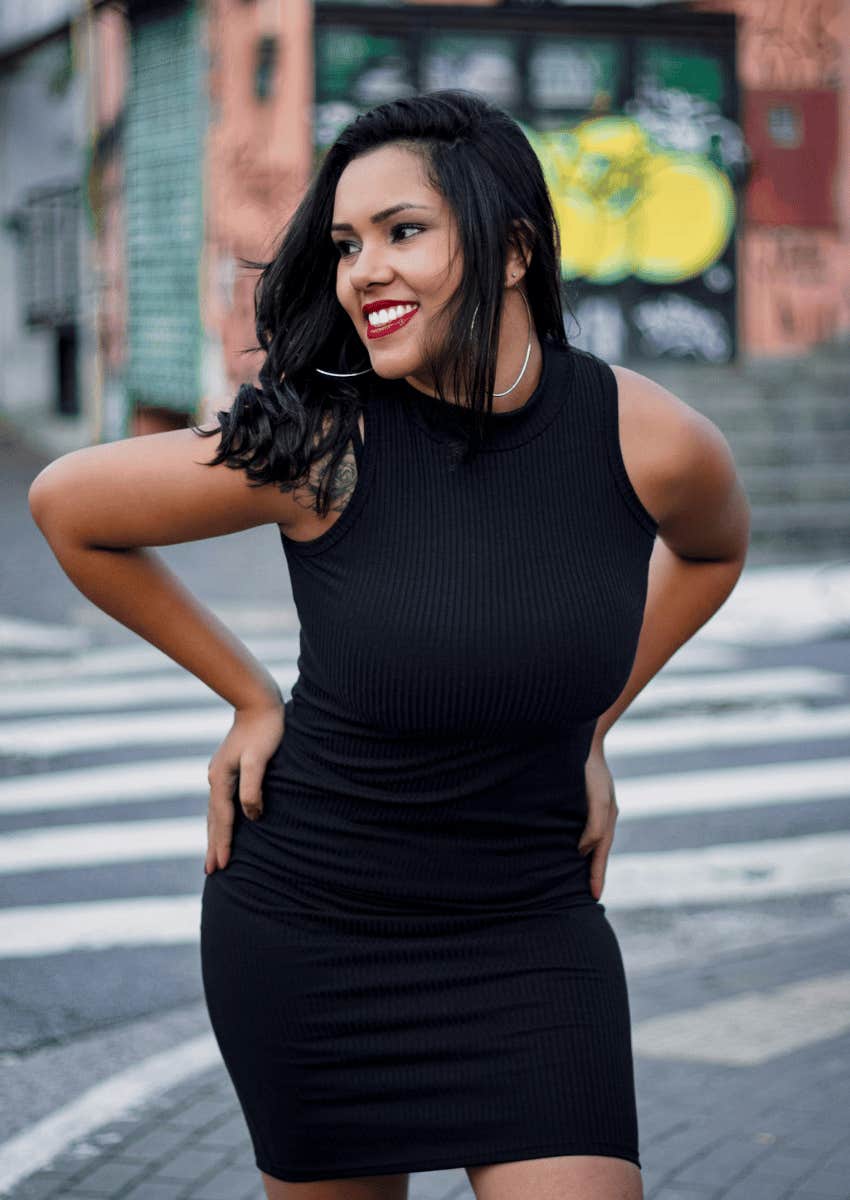 smiling woman wearing a black dress