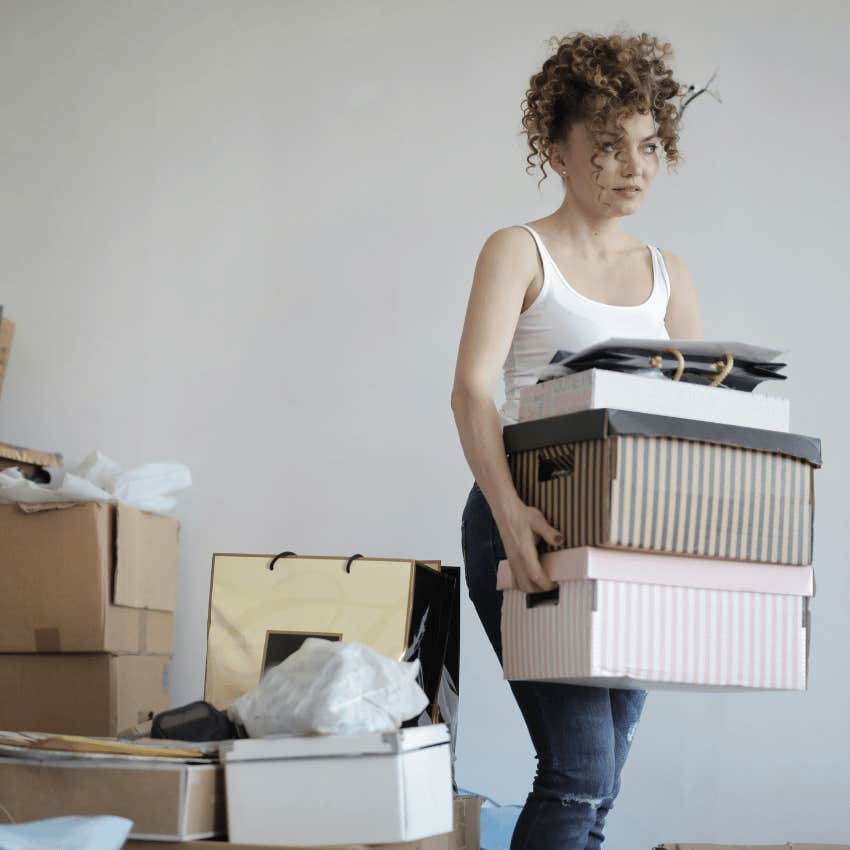 woman spring cleaning moving boxes