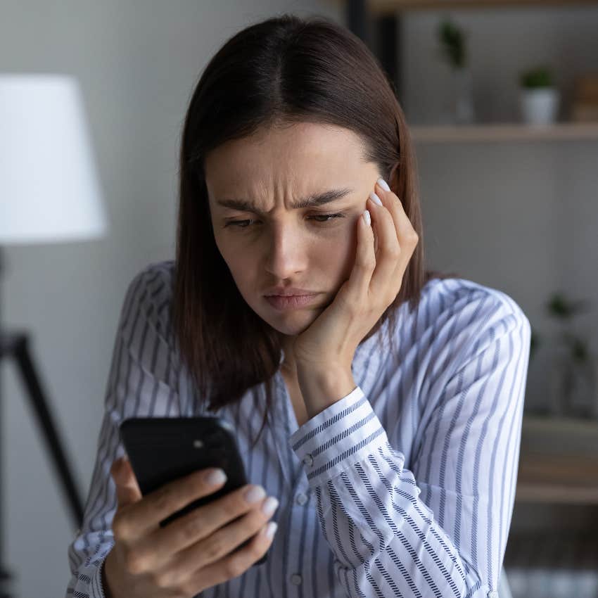 Stressed woman checking her phone