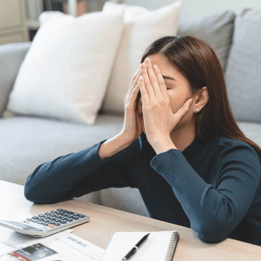 stressed woman making a debt plan