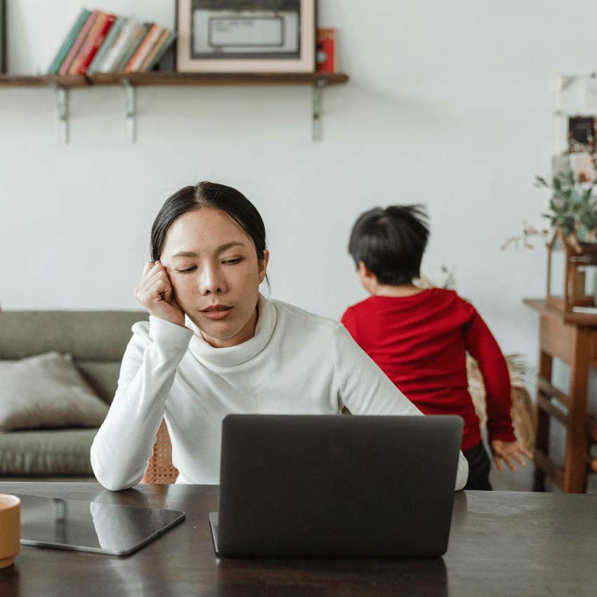 stressed working mom and young boy running around