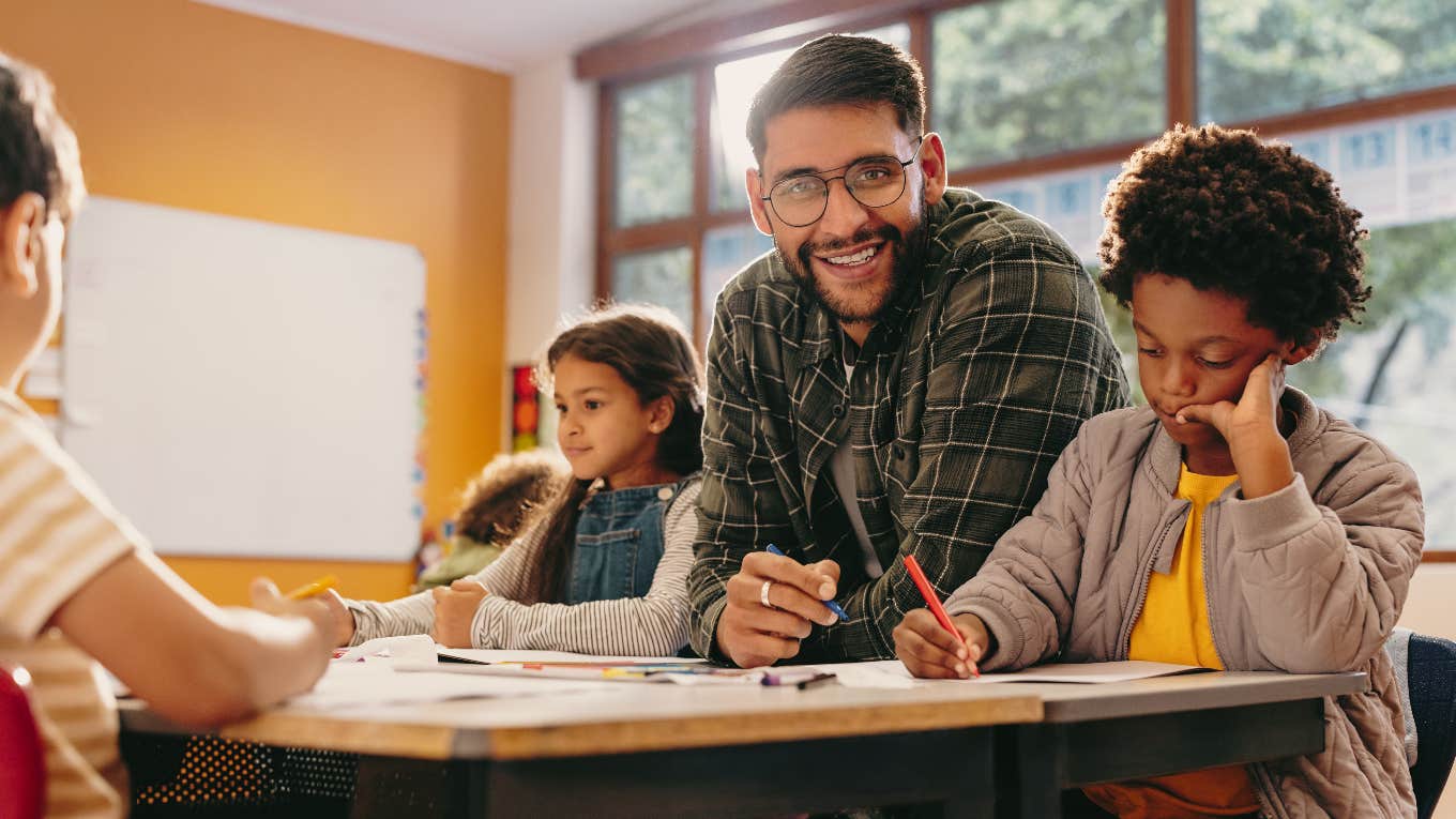 Teacher helping student