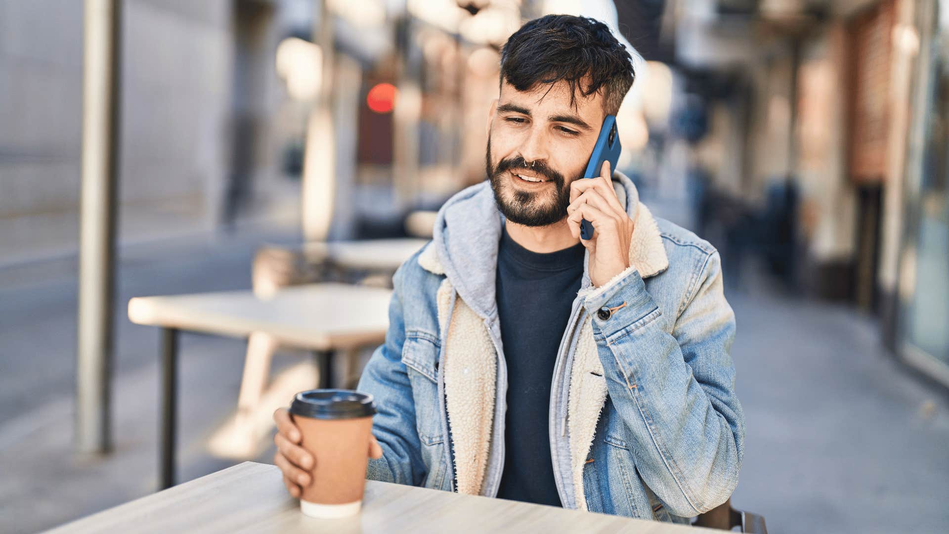 man on phone at cafe