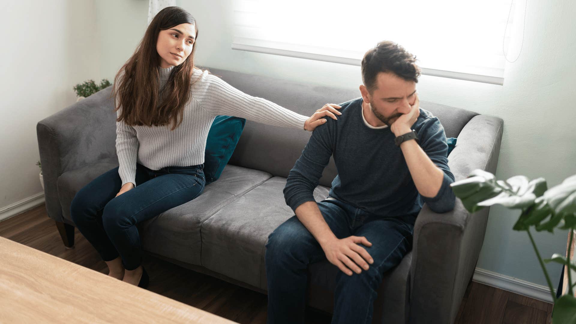 couple arguing on couch