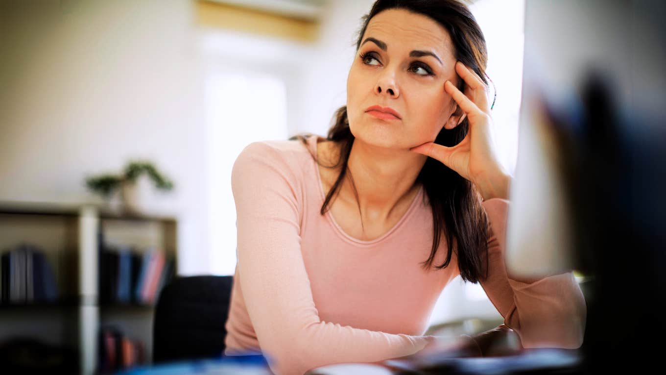 Woman recongizing signs she may be being quiet fired from job. 