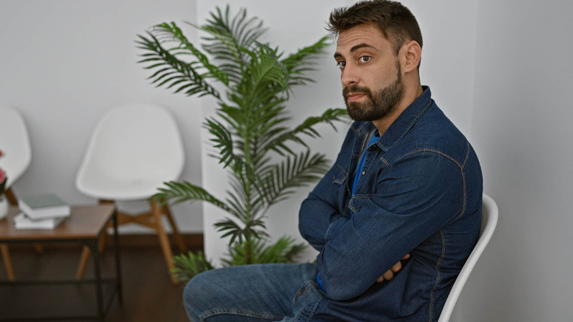 Reserved man sitting in a chair