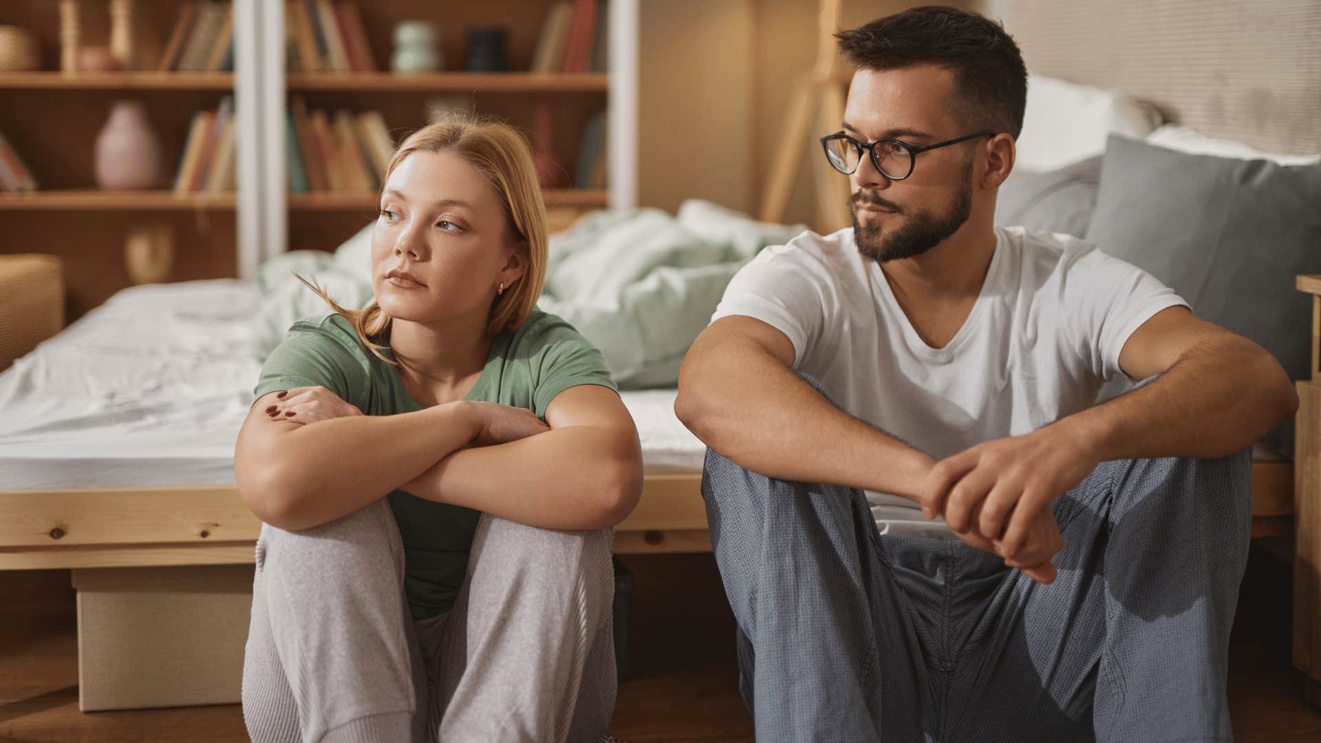 woman ignoring man while he looks at her