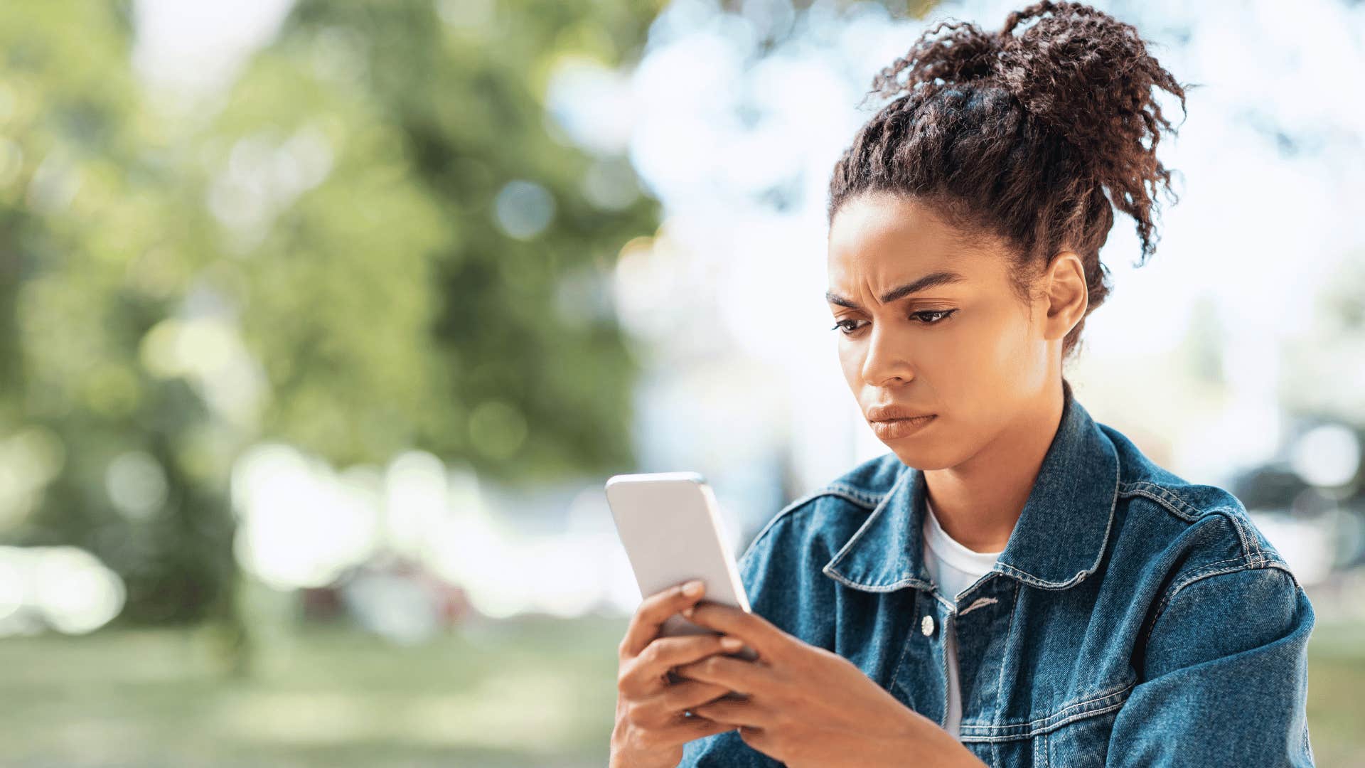 woman looking at her phone