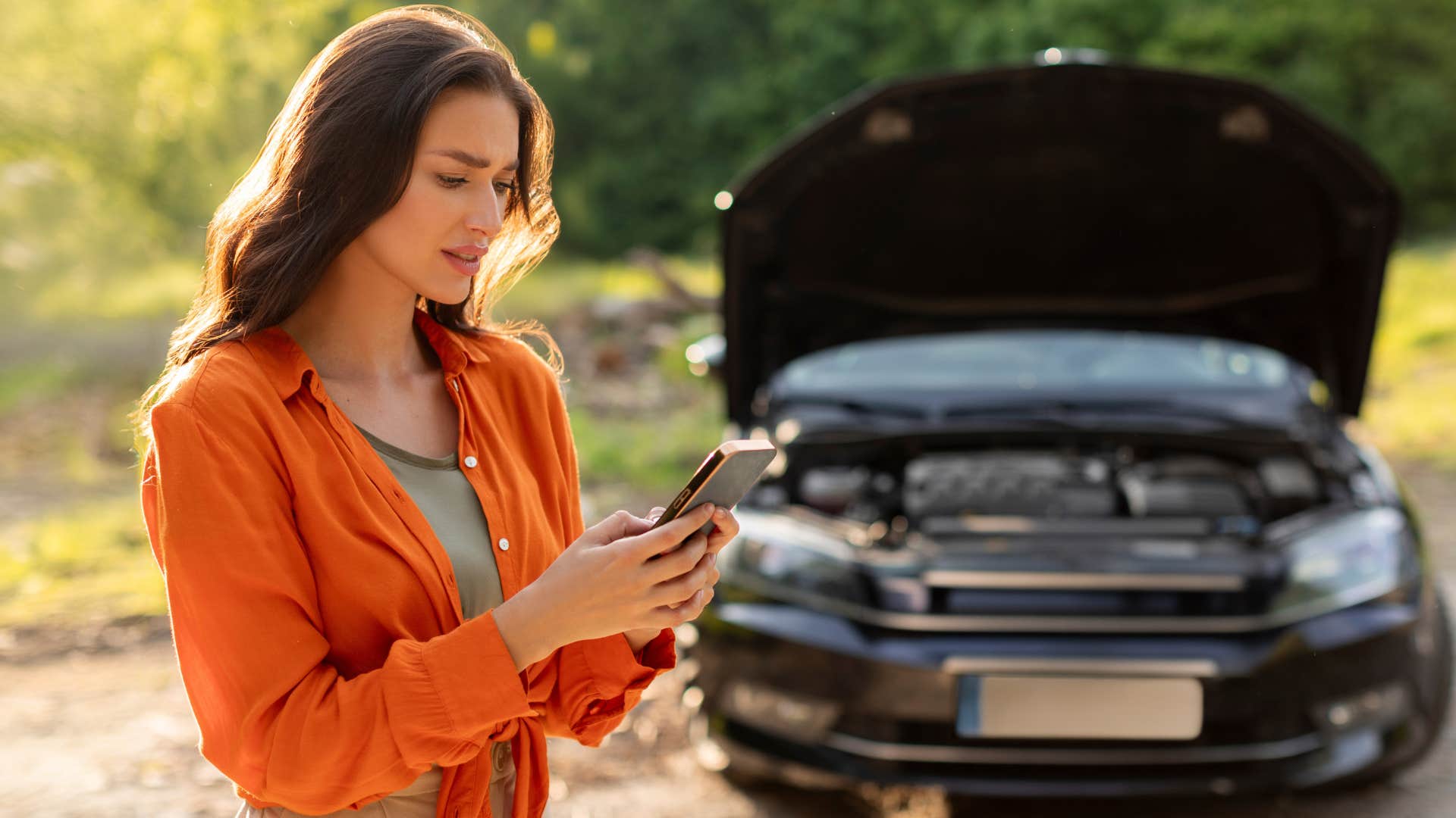 Woman who doesn't know life skill of jump starting a car