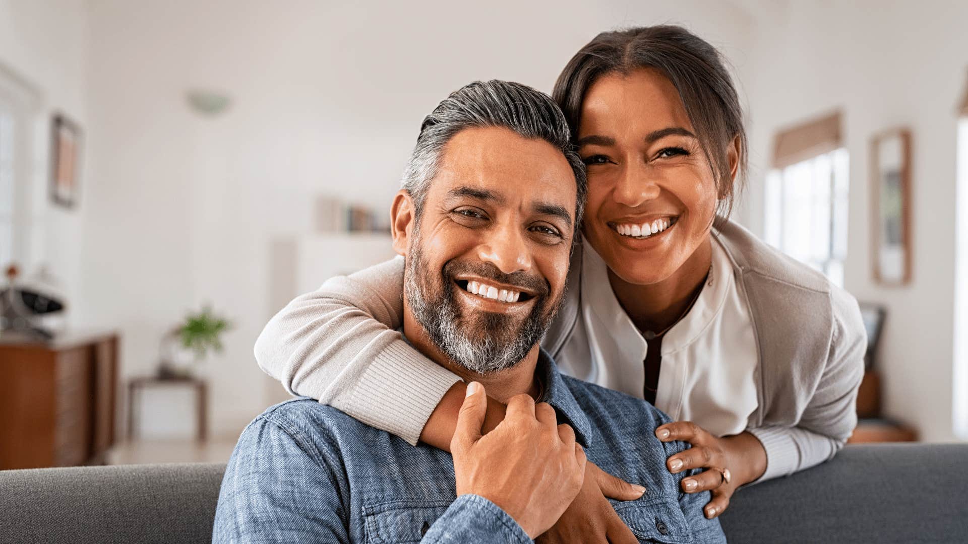 couple smiling and hugging