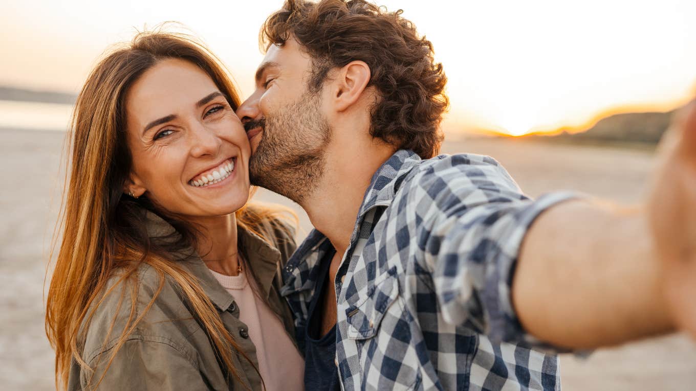 sweet couple man kissing woman cheek