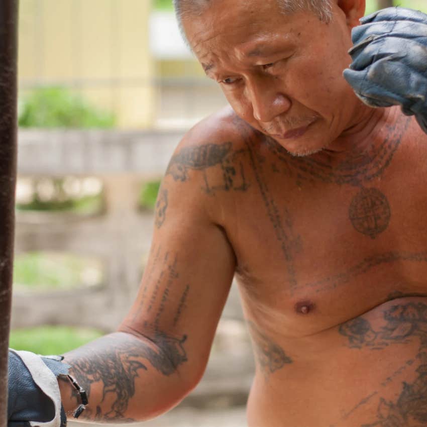 tattooed old man boxing