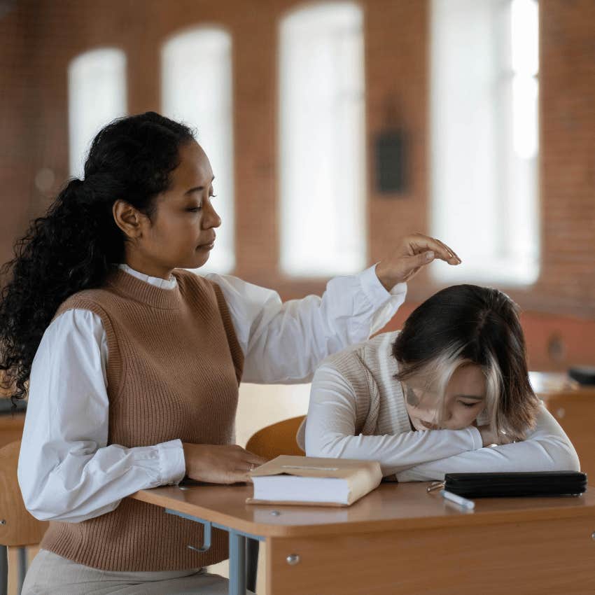 Teacher comforting upset student