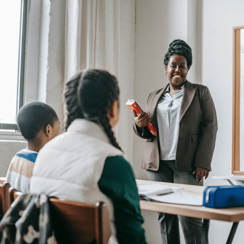 teacher smiling at her students