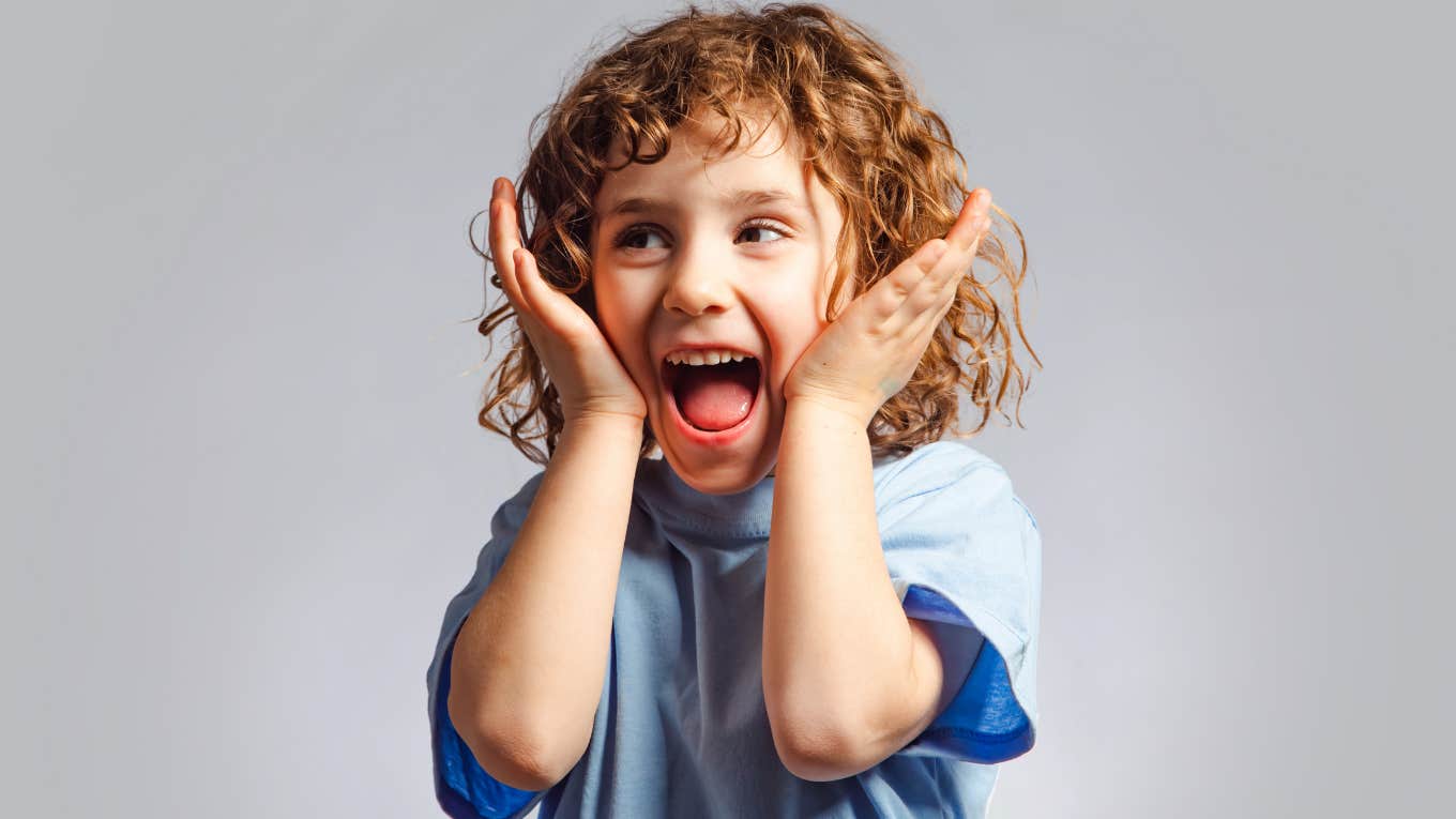 Child smiling and looking happy. 