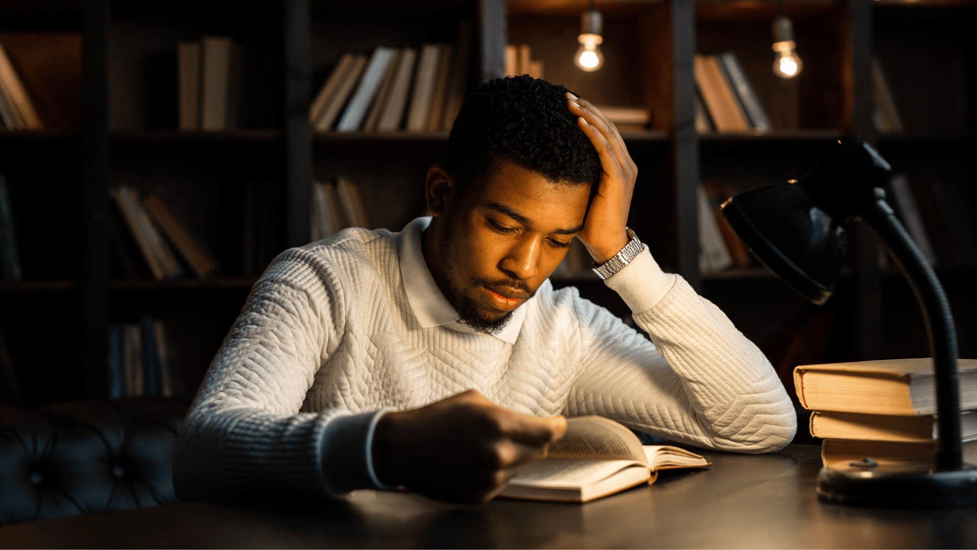 man studying at library without card catalogues