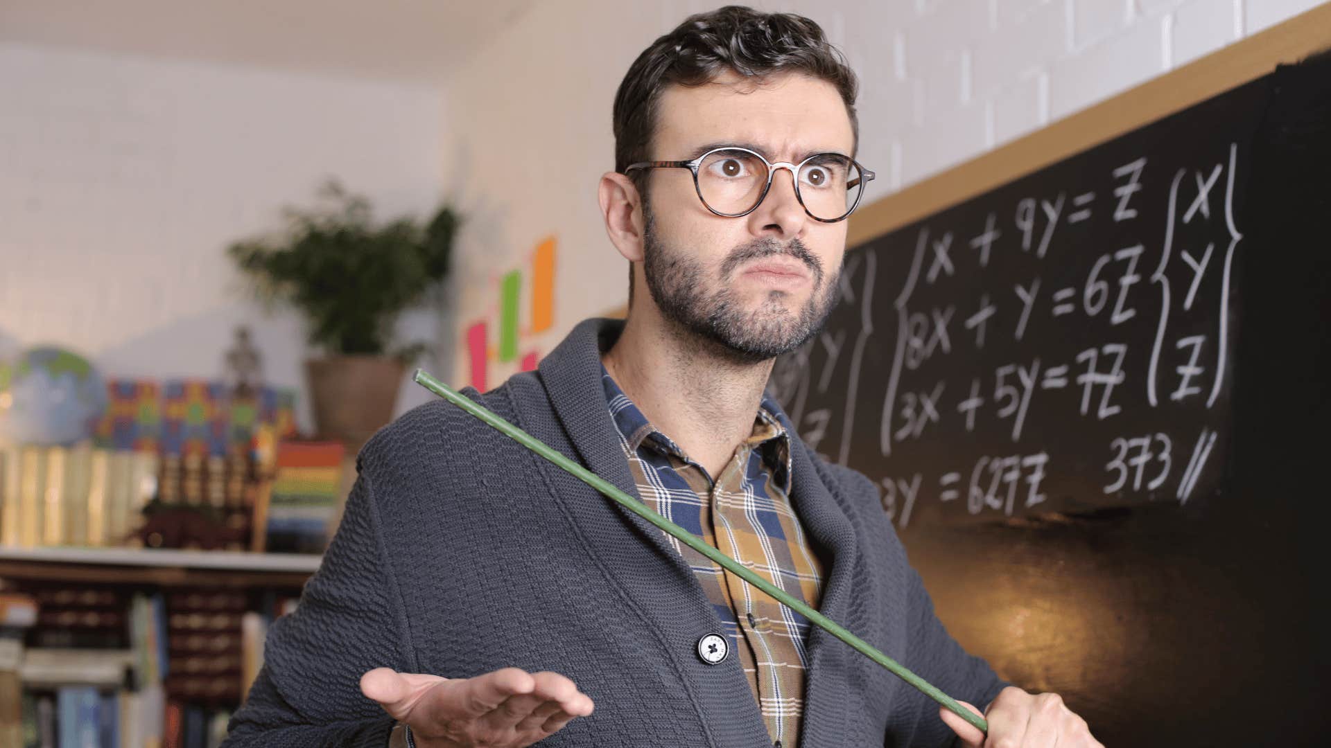 teacher at a chalkboard