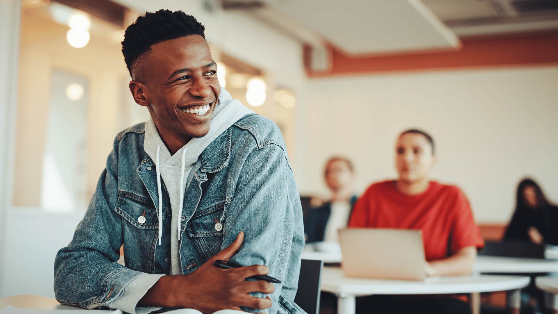 male student in class where kids don't write handwritten notes