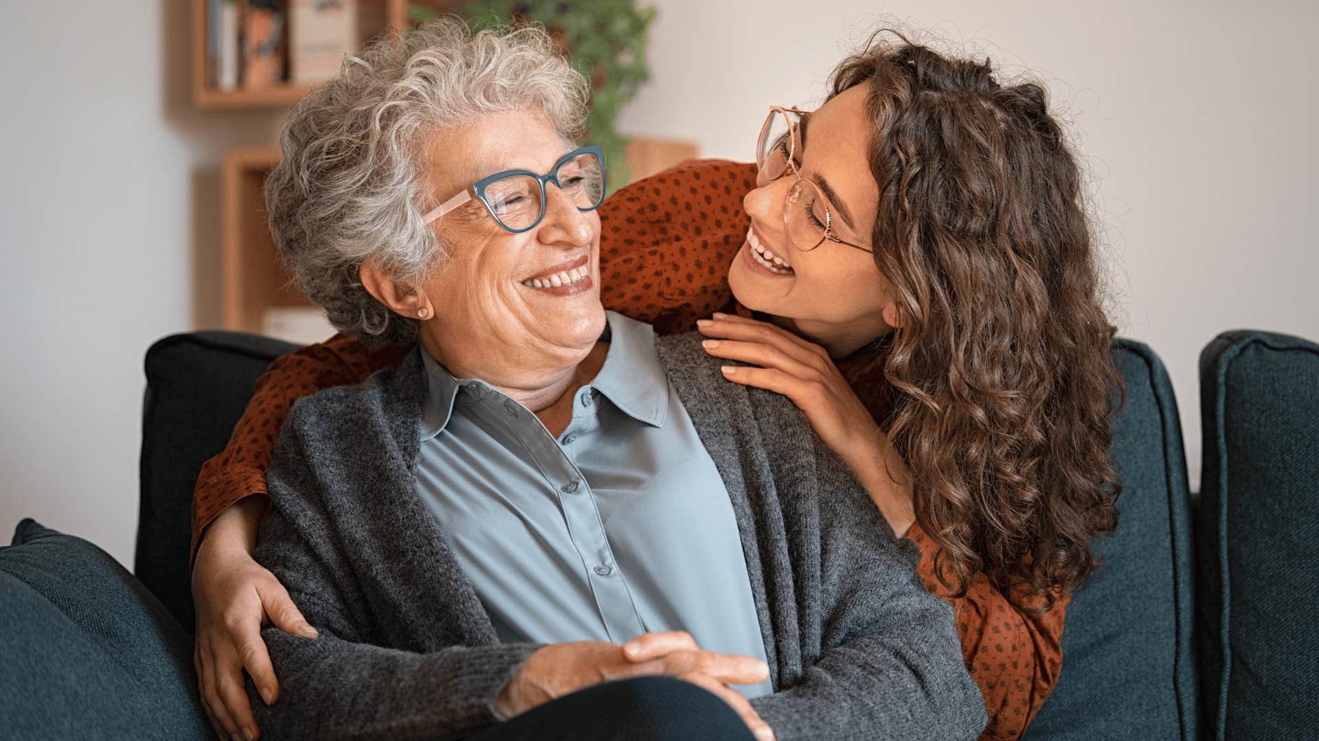 younger woman taking care of older woman 