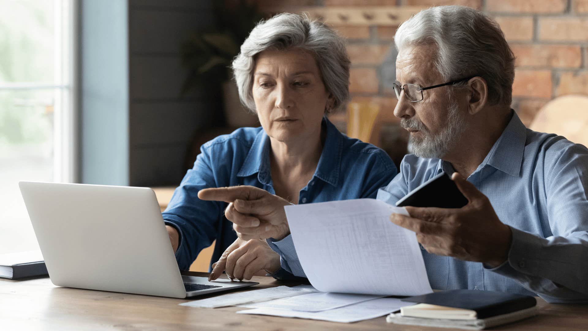 older couple working on saving for retirement