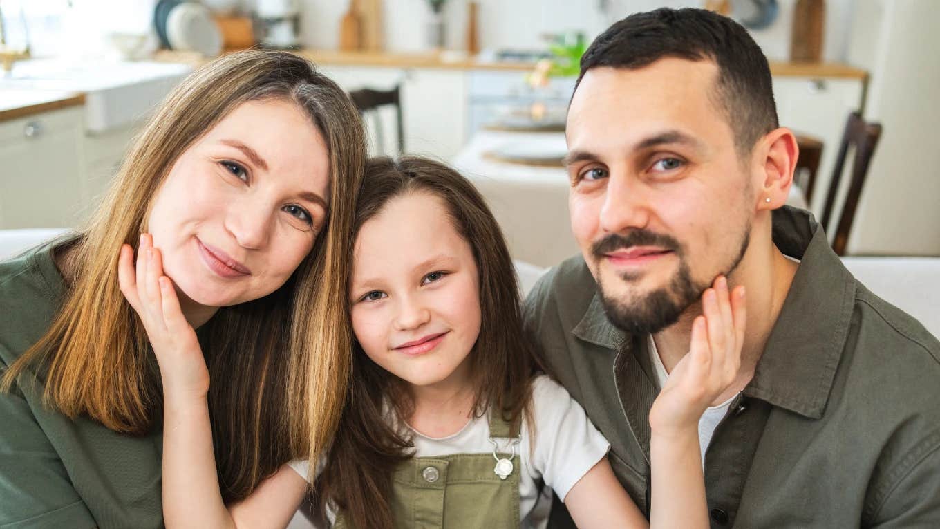 little girl with both parents