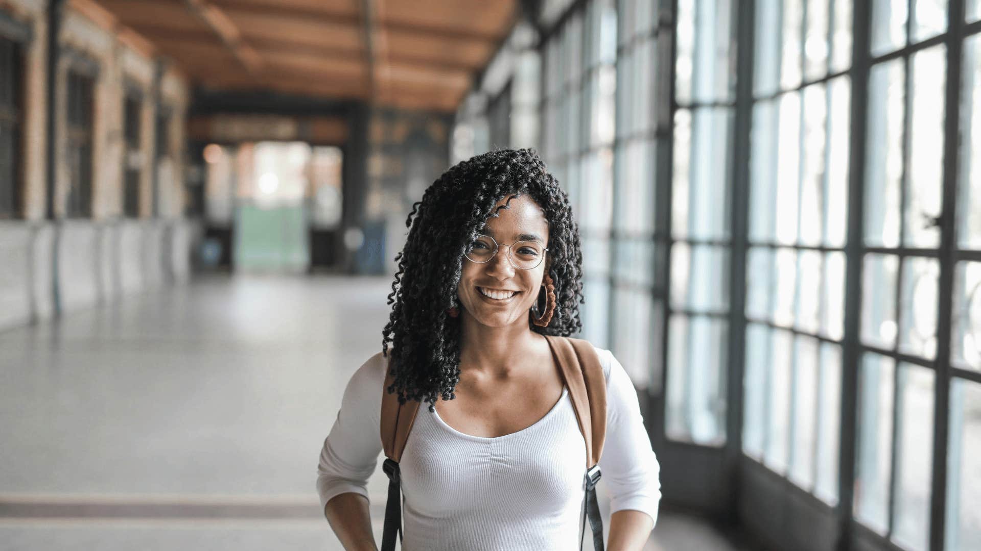 woman smiling in hallway