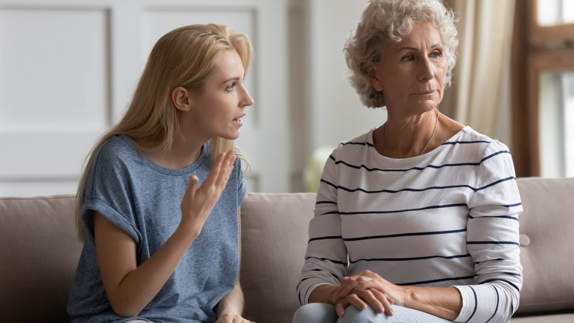 Adult daughter arguing with her mother while she looks away.