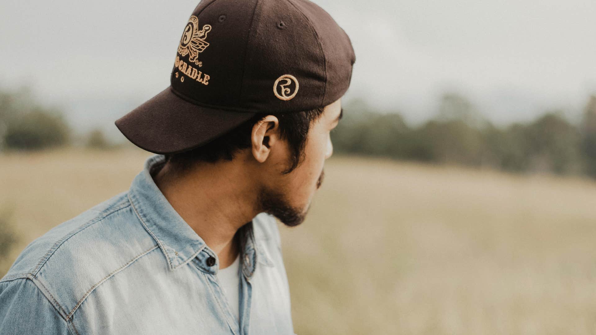 man thinking in field