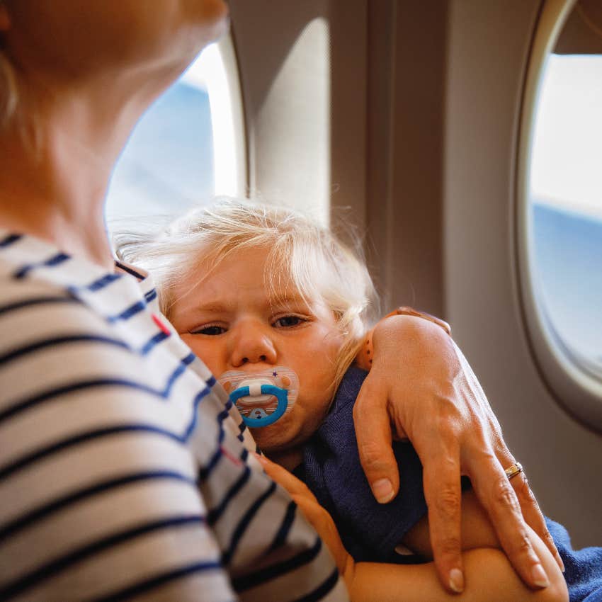 Tired child on airplane