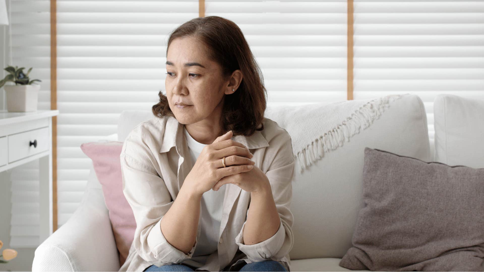 older woman sitting alone