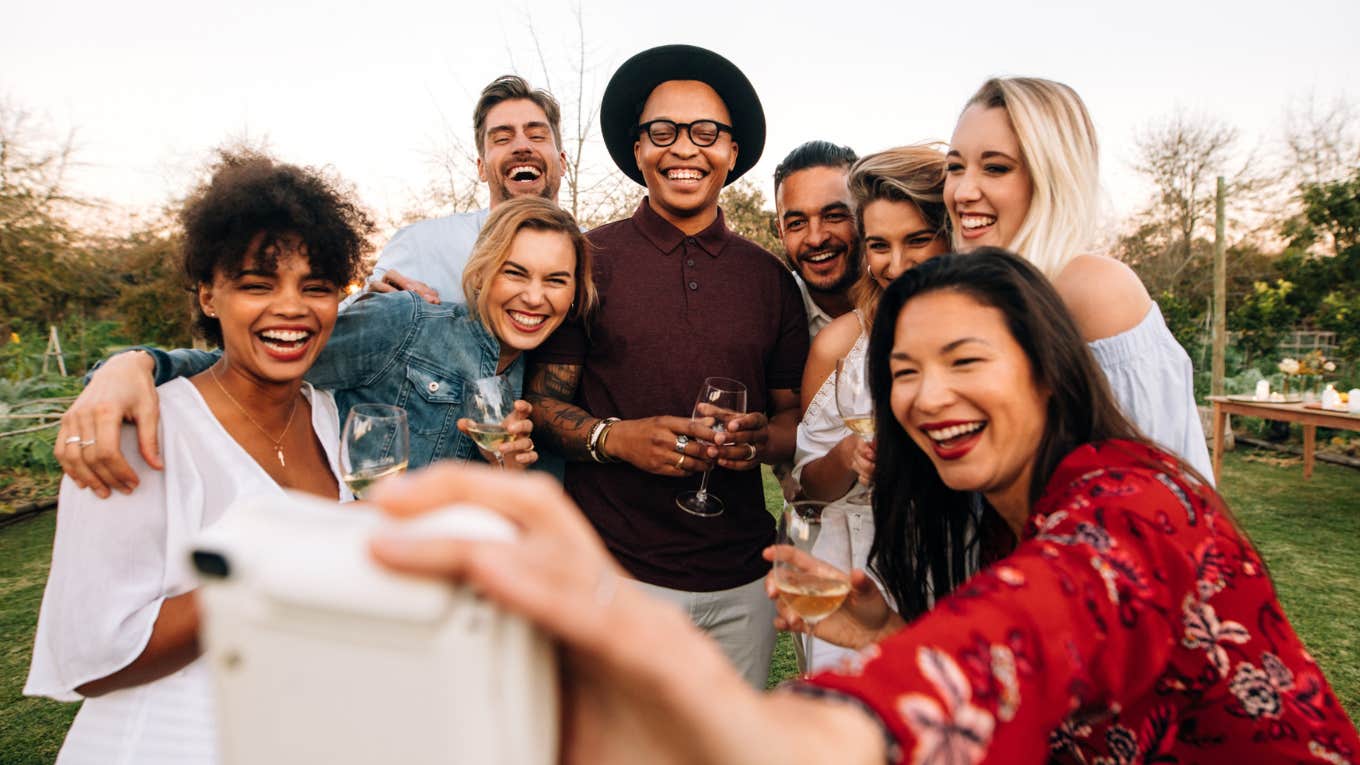 Woman with high self esteem together with her group of friends