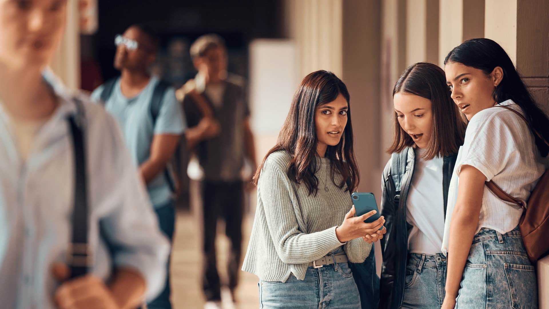 women gossiping about person