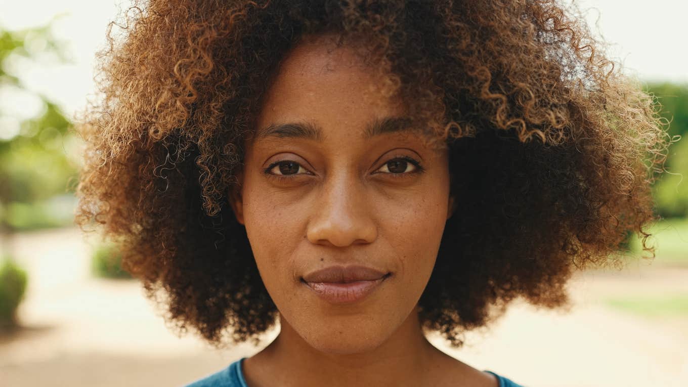 serious woman with curly hair