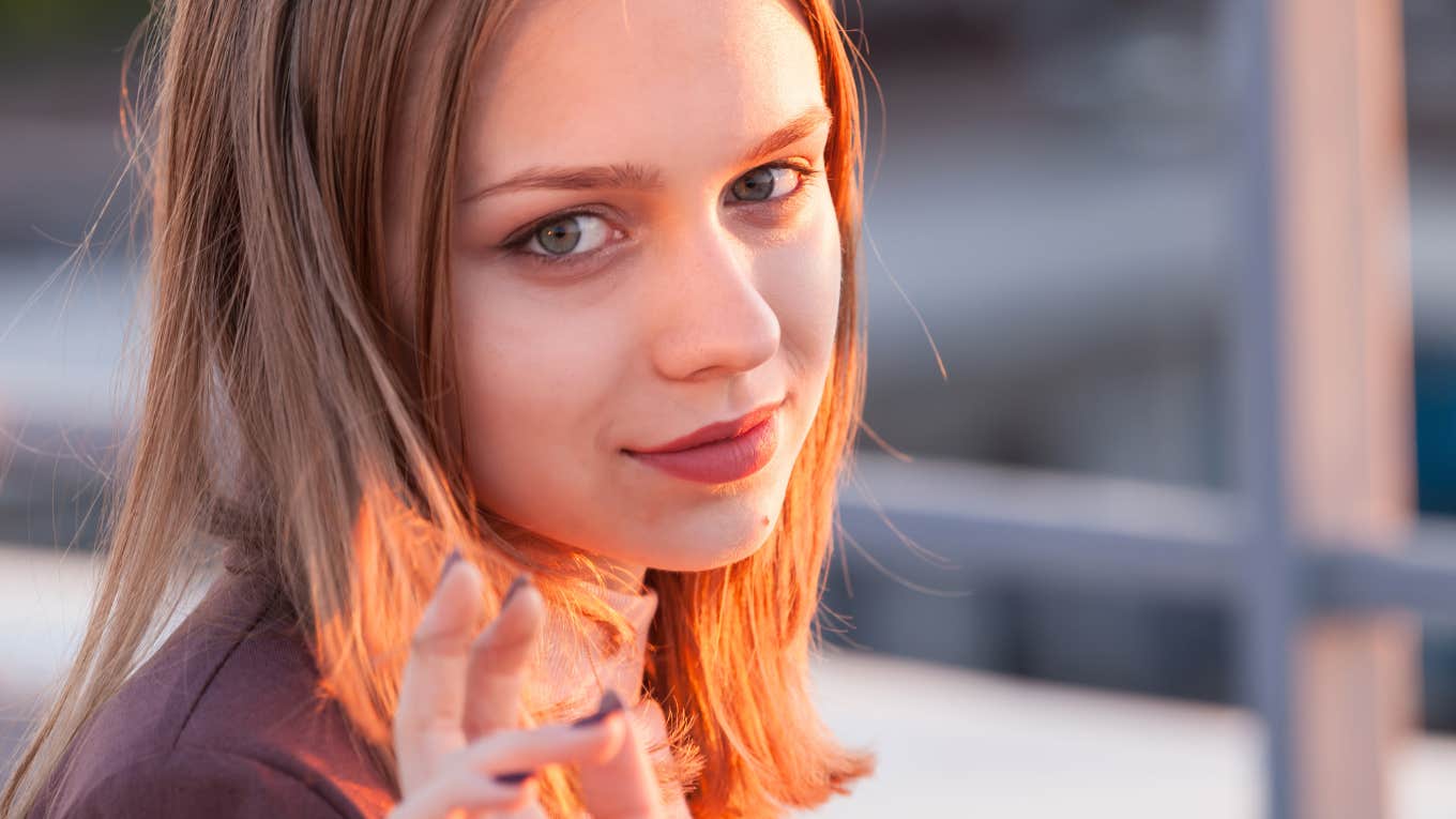 narcissistic young woman twirling her hair