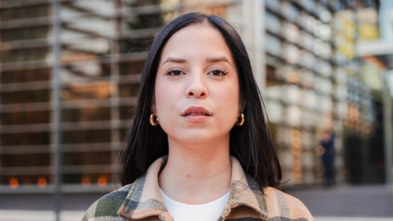 serious angry looking woman standing outside