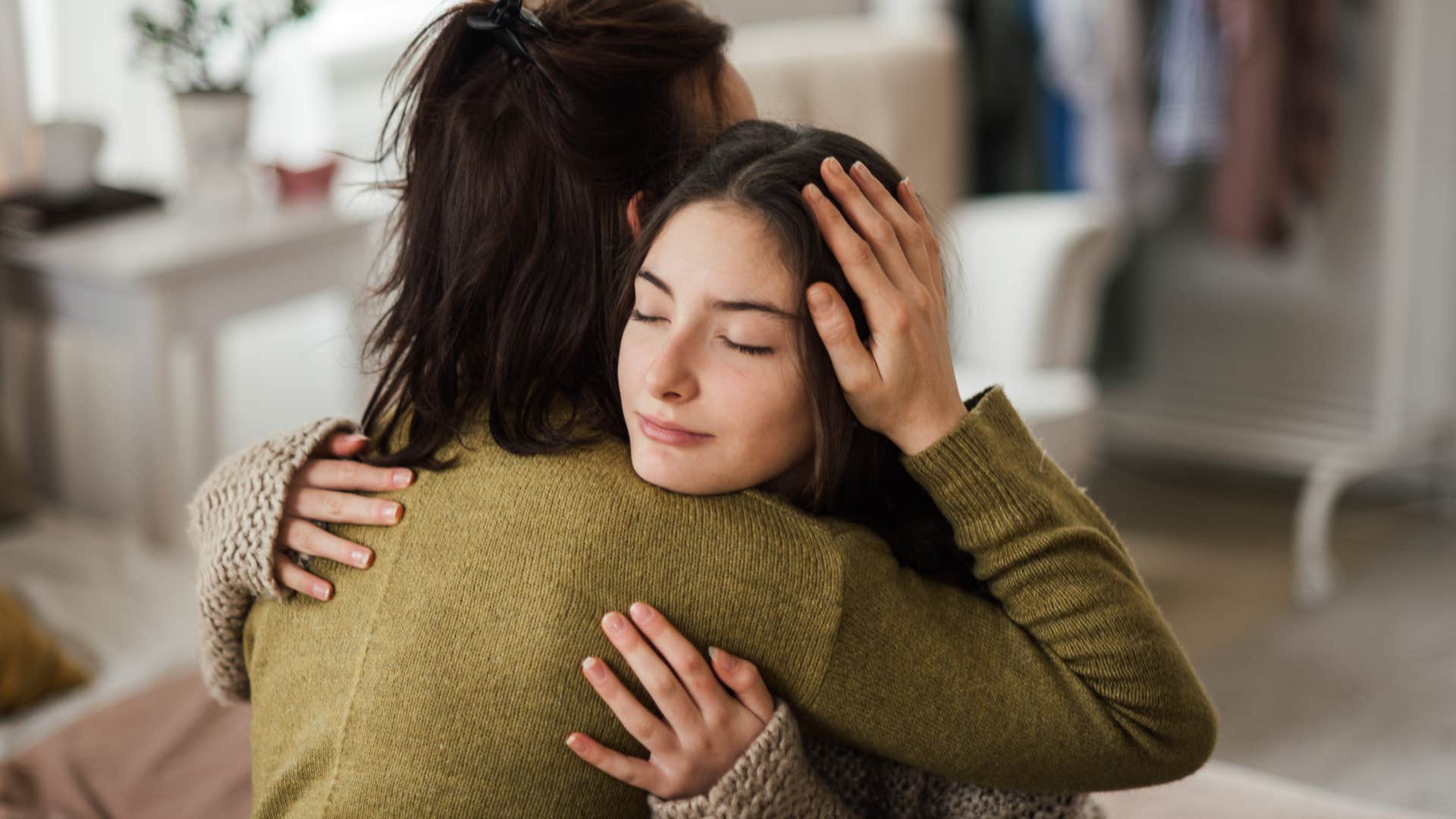 Woman hugging another empathetic person. 