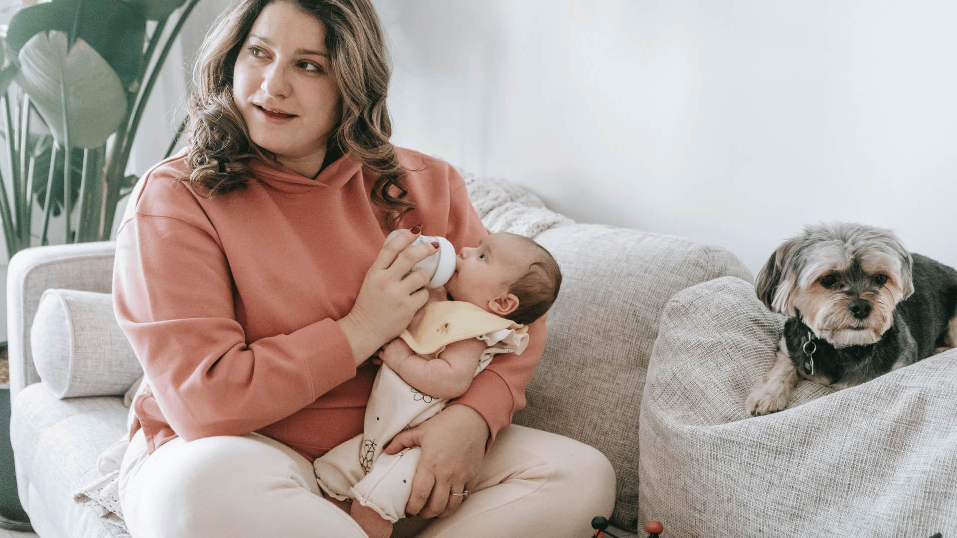 woman feeding baby