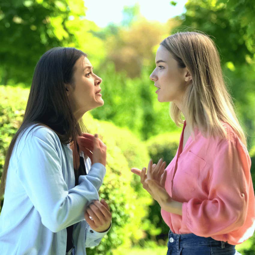 two female friends arguing outdoors