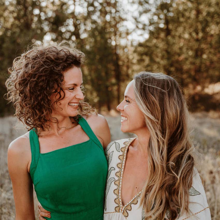 two happy women embracing