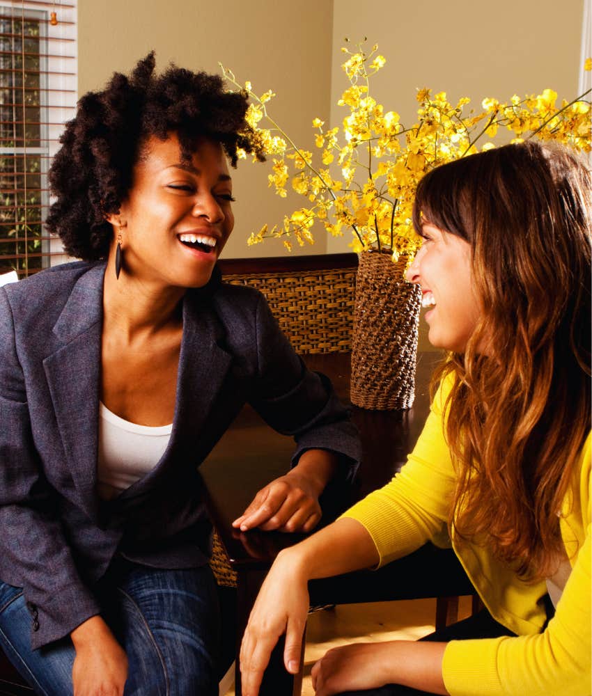 two women talking and laughing